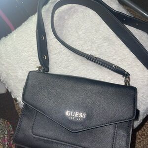 Guess Black Crossbody Bag with Adjustable Strap and Flap Closure